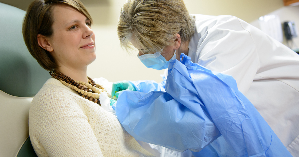 a female patient receiving a medical exam