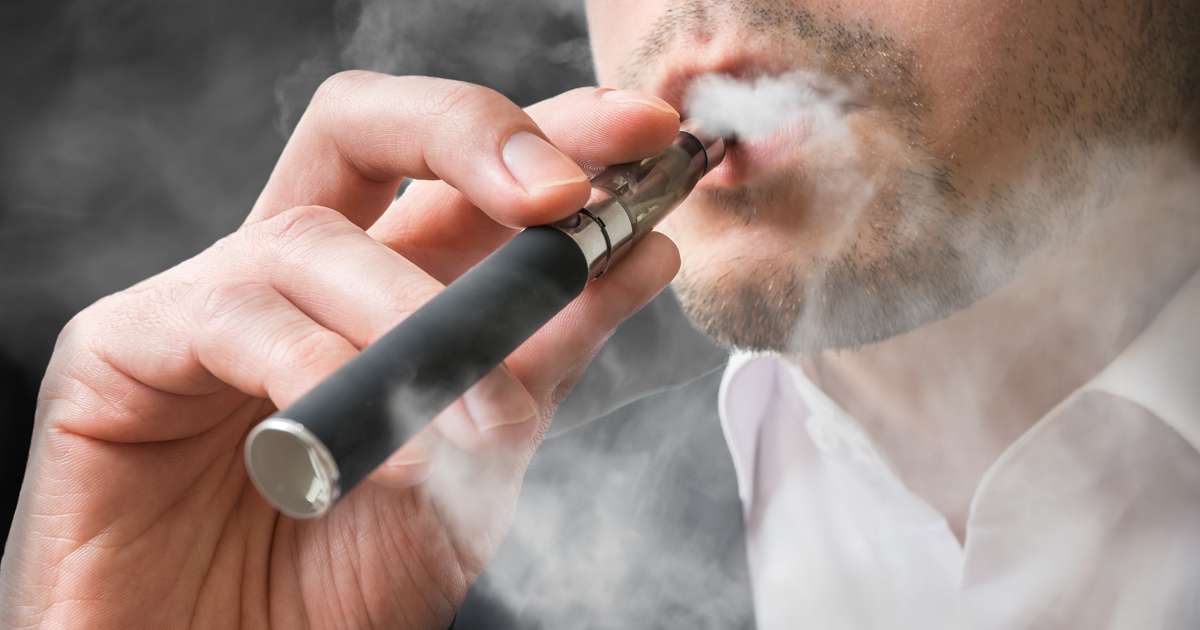 A man smoking an e-cigarette